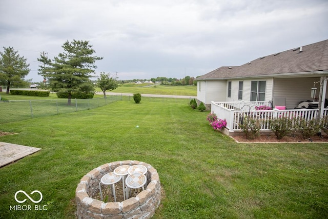 view of yard with a wooden deck