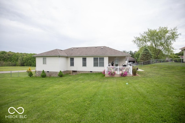 rear view of property featuring crawl space