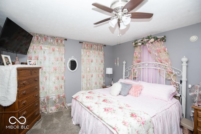 bedroom featuring carpet flooring, baseboards, and a ceiling fan