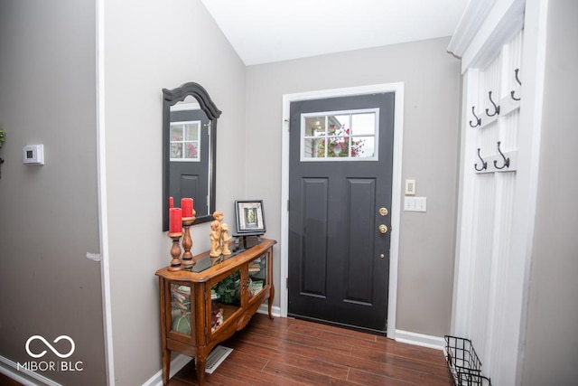 foyer entrance with baseboards and dark wood-style floors