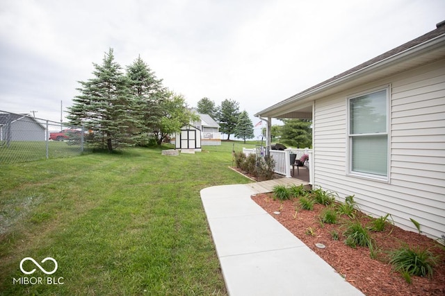 view of yard featuring a storage unit and an outbuilding