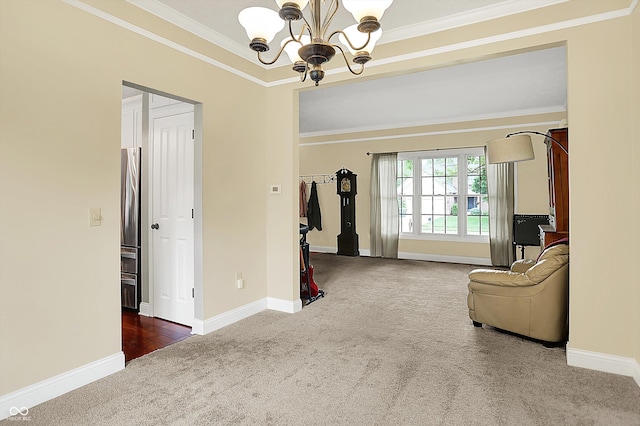 sitting room featuring carpet, a chandelier, crown molding, and baseboards