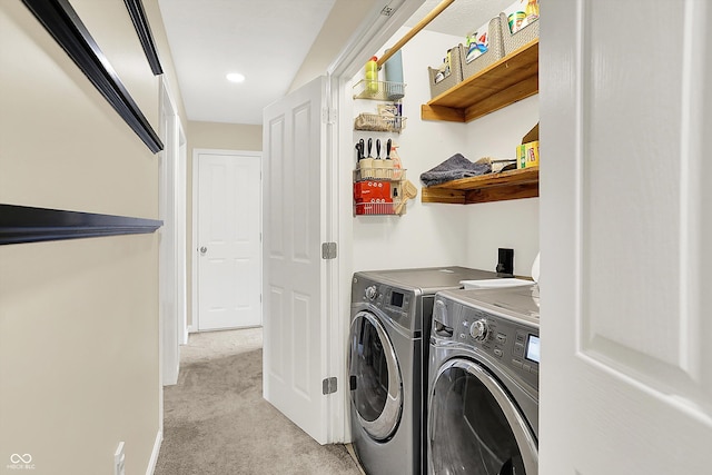washroom with washing machine and clothes dryer, light colored carpet, recessed lighting, and baseboards