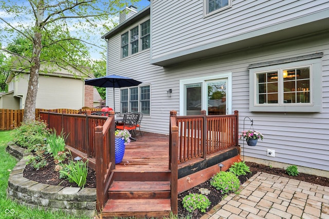 wooden deck with fence and outdoor dining area