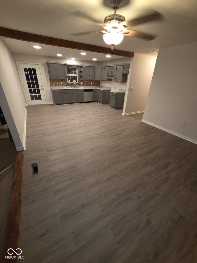 885 S Norkay St, North Vernon, IN 47265 - unfurnished living room featuring recessed lighting, ceiling fan, dark wood-style flooring, and beamed ceiling
