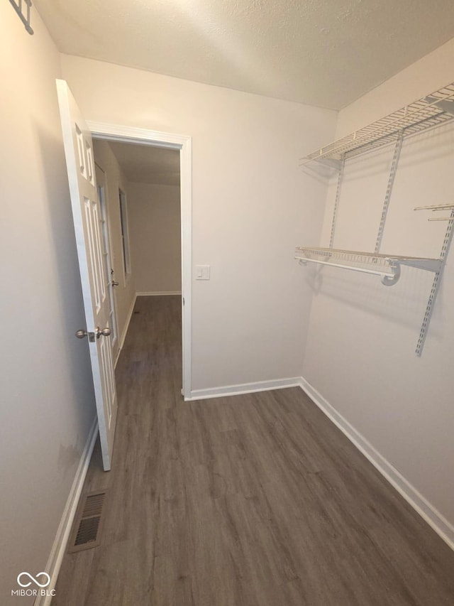 885 S Norkay St, North Vernon, IN 47265 - walk in closet featuring dark wood-type flooring