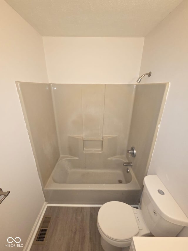 885 S Norkay St, North Vernon, IN 47265 - bathroom featuring wood finished floors and washtub / shower combination