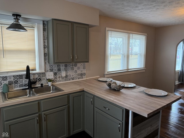 3720 W 16th St, Indianapolis, IN 46222 - kitchen featuring wood counters, a sink, gray cabinets, and a textured ceiling