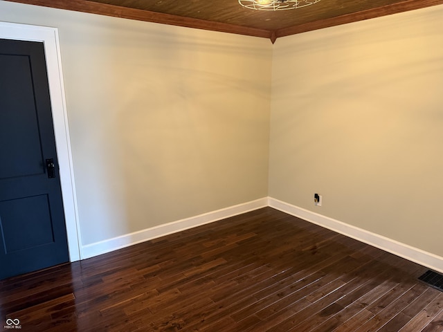 3720 W 16th St, Indianapolis, IN 46222 - empty room featuring baseboards, crown molding, and dark wood-type flooring