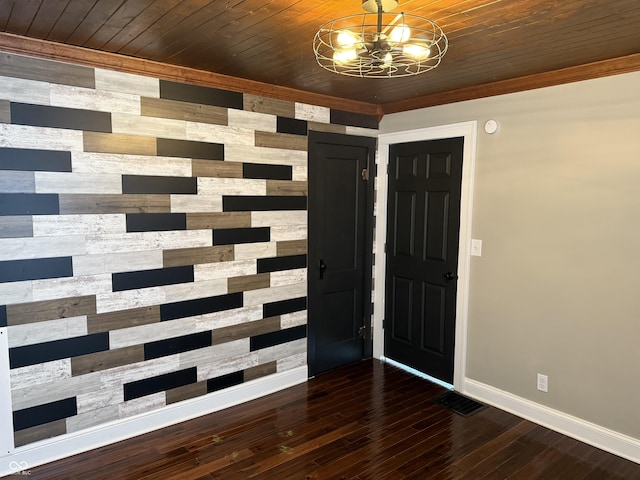 3720 W 16th St, Indianapolis, IN 46222 - foyer entrance featuring wood walls, baseboards, a chandelier, dark wood-style flooring, and wood ceiling