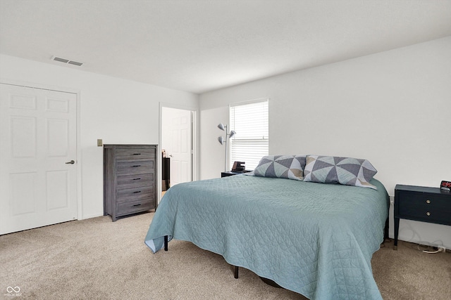 bedroom featuring light colored carpet
