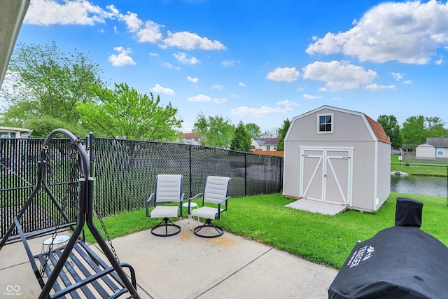 view of patio featuring a storage shed and an outdoor structure