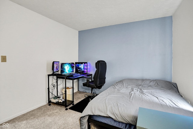 bedroom with carpet floors and baseboards