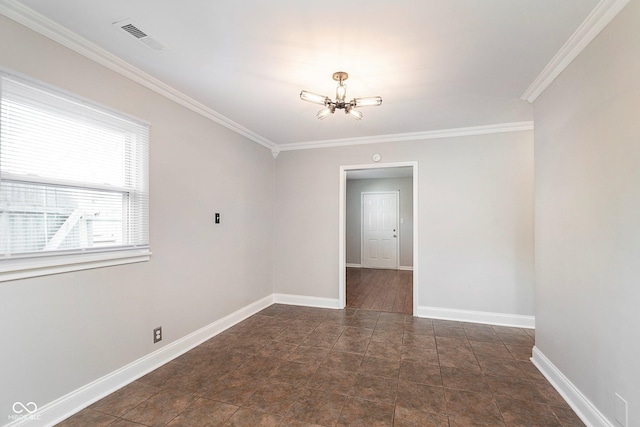 spare room with a chandelier, ornamental molding, and baseboards