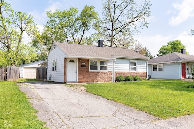 view of front of property featuring driveway and roof with shingles
