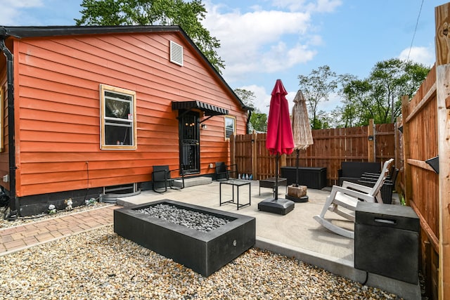 3302 N Gladstone Ave, Indianapolis, IN 46218 - view of patio with a fire pit and fence