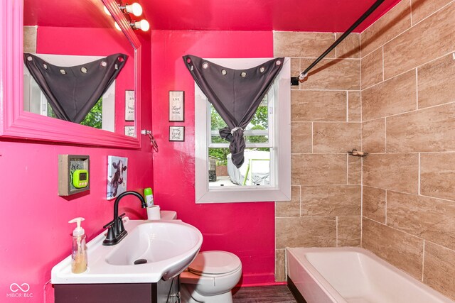 3302 N Gladstone Ave, Indianapolis, IN 46218 - full bathroom featuring vanity, toilet, and bathtub / shower combination