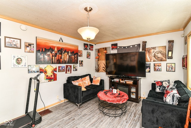 3302 N Gladstone Ave, Indianapolis, IN 46218 - living area with ornamental molding, wood finished floors, a textured ceiling, and baseboards