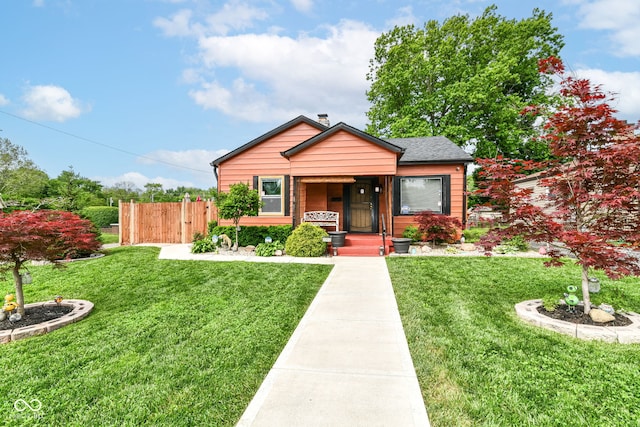 3302 N Gladstone Ave, Indianapolis, IN 46218 - bungalow-style home featuring a porch