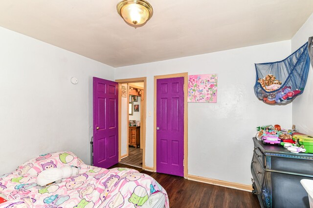 3302 N Gladstone Ave, Indianapolis, IN 46218 - bedroom with wood finished floors and baseboards