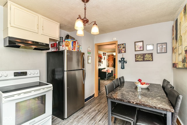 3302 N Gladstone Ave, Indianapolis, IN 46218 - kitchen featuring white electric range, freestanding refrigerator, light wood-style flooring, under cabinet range hood, and a textured ceiling