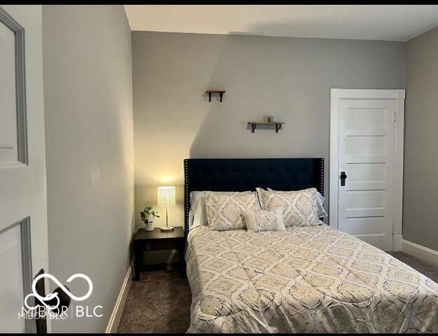 bedroom featuring carpet floors and baseboards