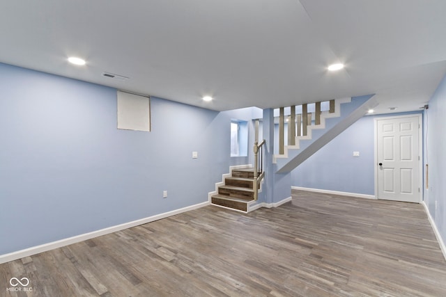641 E 33rd St, Indianapolis, IN 46205 - finished basement with stairway, wood finished floors, baseboards, and recessed lighting
