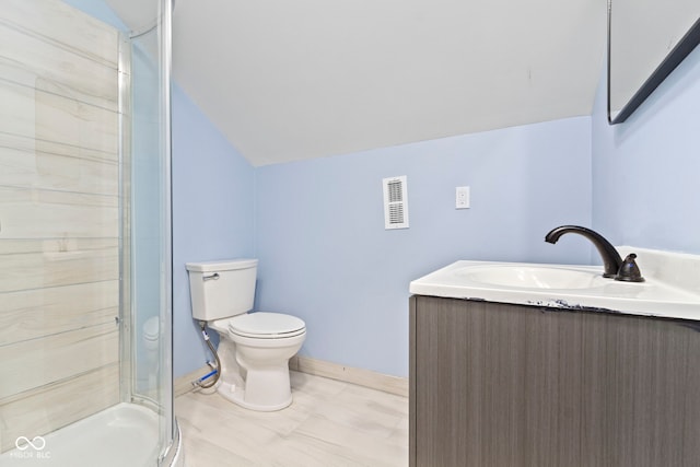 641 E 33rd St, Indianapolis, IN 46205 - full bath with lofted ceiling, toilet, a stall shower, and vanity