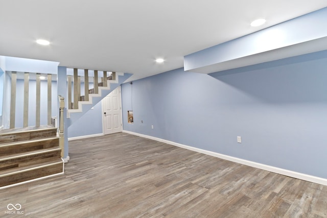 641 E 33rd St, Indianapolis, IN 46205 - finished basement featuring wood finished floors, baseboards, stairway, and recessed lighting