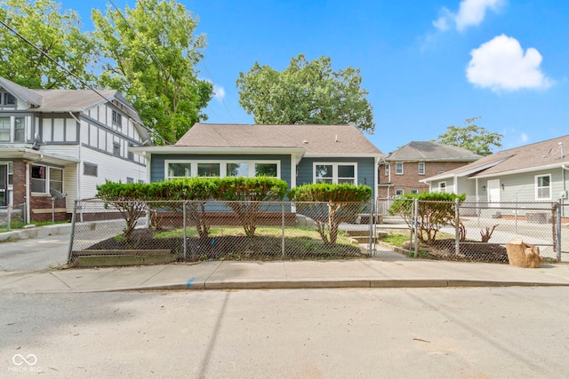 641 E 33rd St, Indianapolis, IN 46205 - view of front of house featuring a fenced front yard and a gate