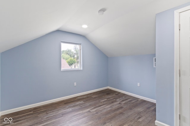 641 E 33rd St, Indianapolis, IN 46205 - additional living space with dark wood-type flooring, lofted ceiling, and baseboards