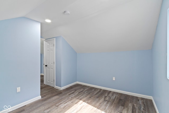 641 E 33rd St, Indianapolis, IN 46205 - bonus room with vaulted ceiling, wood finished floors, and baseboards