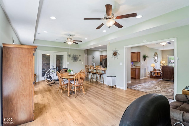dining space featuring light wood-style flooring, ceiling fan, french doors, and recessed lighting
