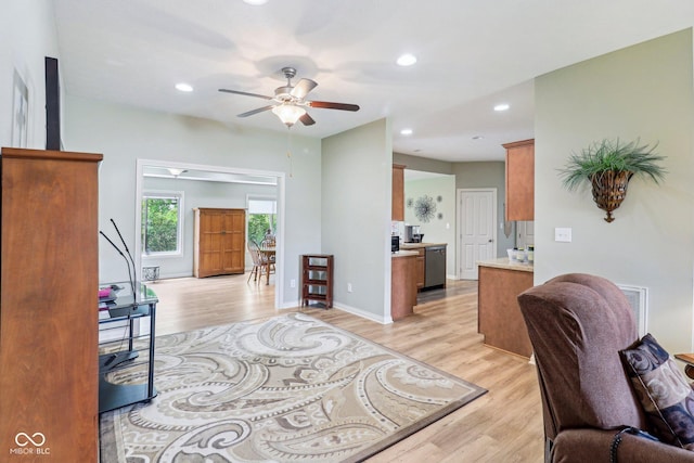 entryway featuring light wood-type flooring, ceiling fan, recessed lighting, and baseboards