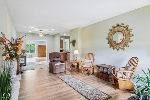 living area featuring recessed lighting, light wood-style floors, and ceiling fan