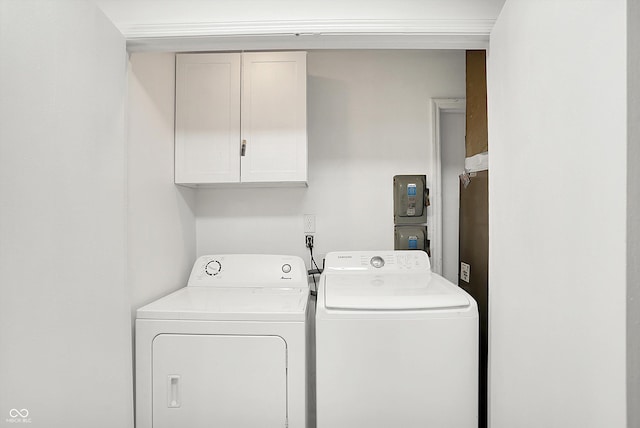 7642 Lancer Ln, Lawrence, IN 46226 - clothes washing area featuring independent washer and dryer and cabinet space