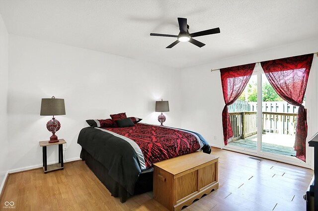 7642 Lancer Ln, Lawrence, IN 46226 - bedroom with access to outside, light wood-type flooring, baseboards, and a ceiling fan