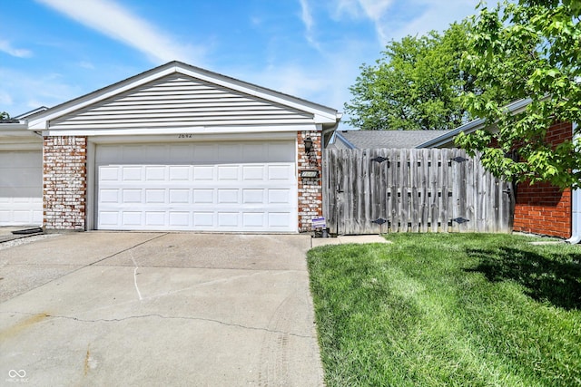 7642 Lancer Ln, Lawrence, IN 46226 - view of front facade featuring brick siding and a garage