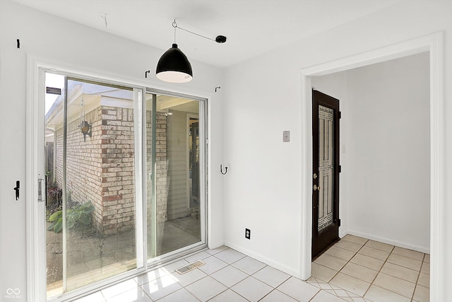 7642 Lancer Ln, Lawrence, IN 46226 - spare room featuring light tile patterned floors and baseboards