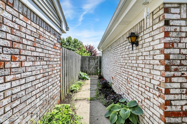 7642 Lancer Ln, Lawrence, IN 46226 - view of side of property featuring brick siding and fence
