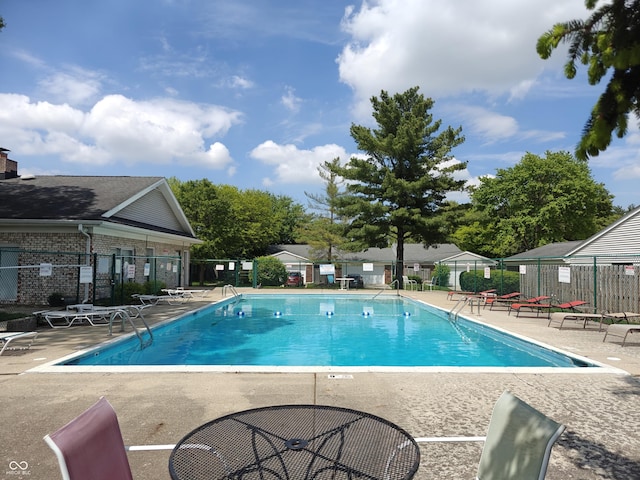 7642 Lancer Ln, Lawrence, IN 46226 - community pool with fence and a patio