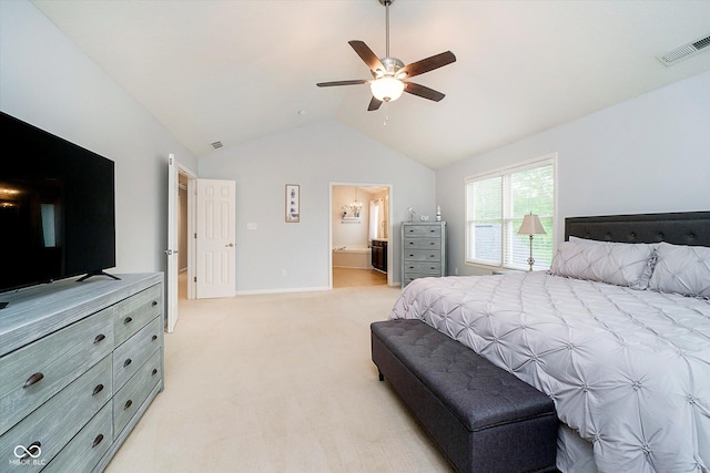 bedroom featuring lofted ceiling, light colored carpet, a ceiling fan, ensuite bathroom, and baseboards