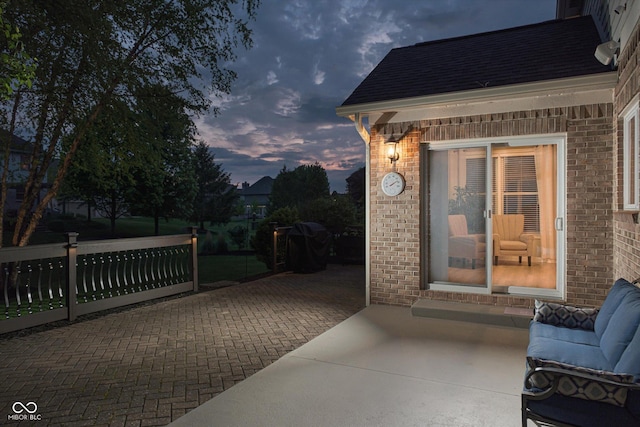 view of patio terrace at dusk