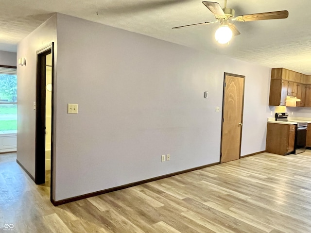 124 Brookside Dr, Hope, IN 47246 - kitchen with stainless steel electric range oven, light wood finished floors, ceiling fan, a textured ceiling, and light countertops