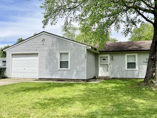 124 Brookside Dr, Hope, IN 47246 - view of front of house featuring a garage, a front lawn, and concrete driveway