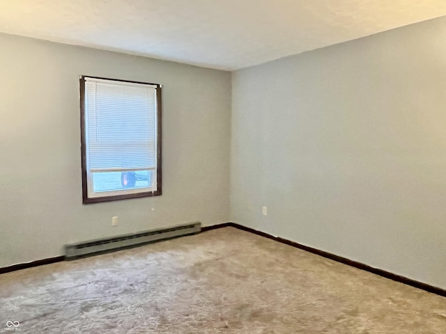 124 Brookside Dr, Hope, IN 47246 - unfurnished room featuring baseboard heating, carpet floors, and baseboards
