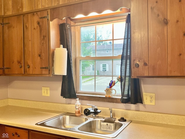 124 Brookside Dr, Hope, IN 47246 - kitchen with a sink, brown cabinets, and light countertops