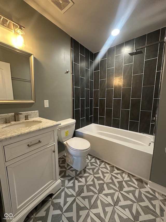 full bath with vanity, toilet, and shower / washtub combination