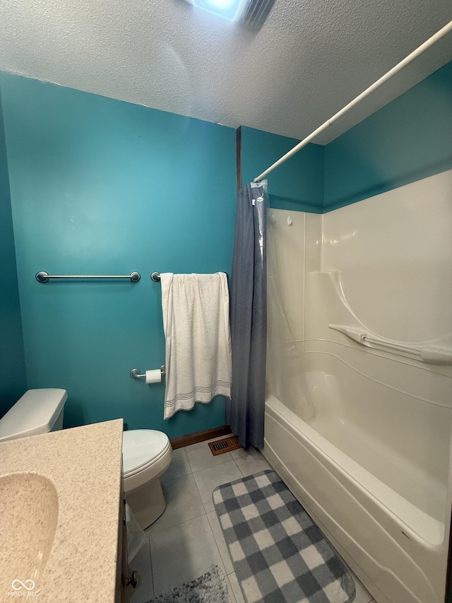 full bath with a textured ceiling, toilet, tile patterned floors, shower / bath combo with shower curtain, and vanity