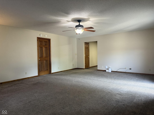 carpeted spare room featuring a ceiling fan, baseboards, and a textured ceiling